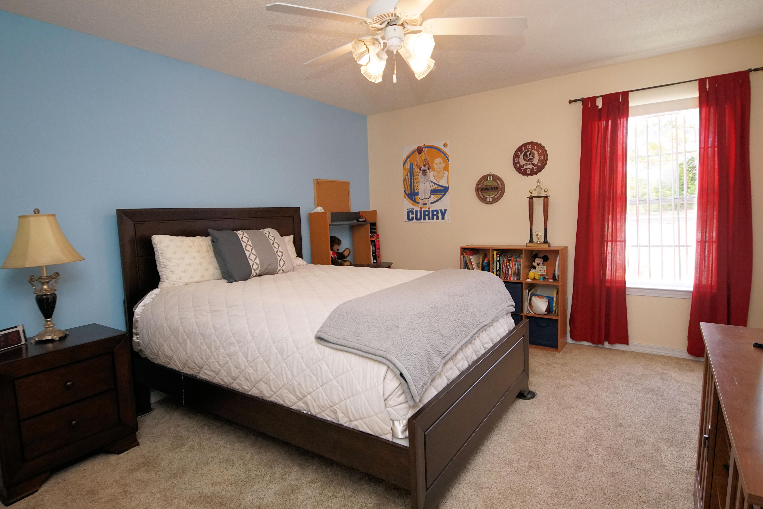 1956 Woodcrest Ridge Fort Walton Beach, FL 32547 - Photo 15 of 23 a large bed sitting in a bedroom next to a window