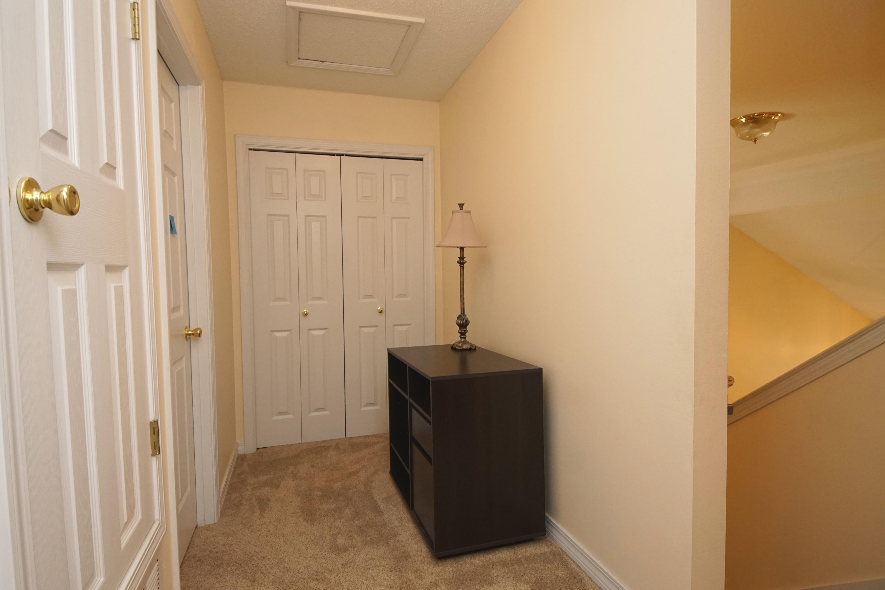 1956 Woodcrest Ridge Fort Walton Beach, FL 32547 - Photo 18 of 23 a view of a hallway with wooden cabinets