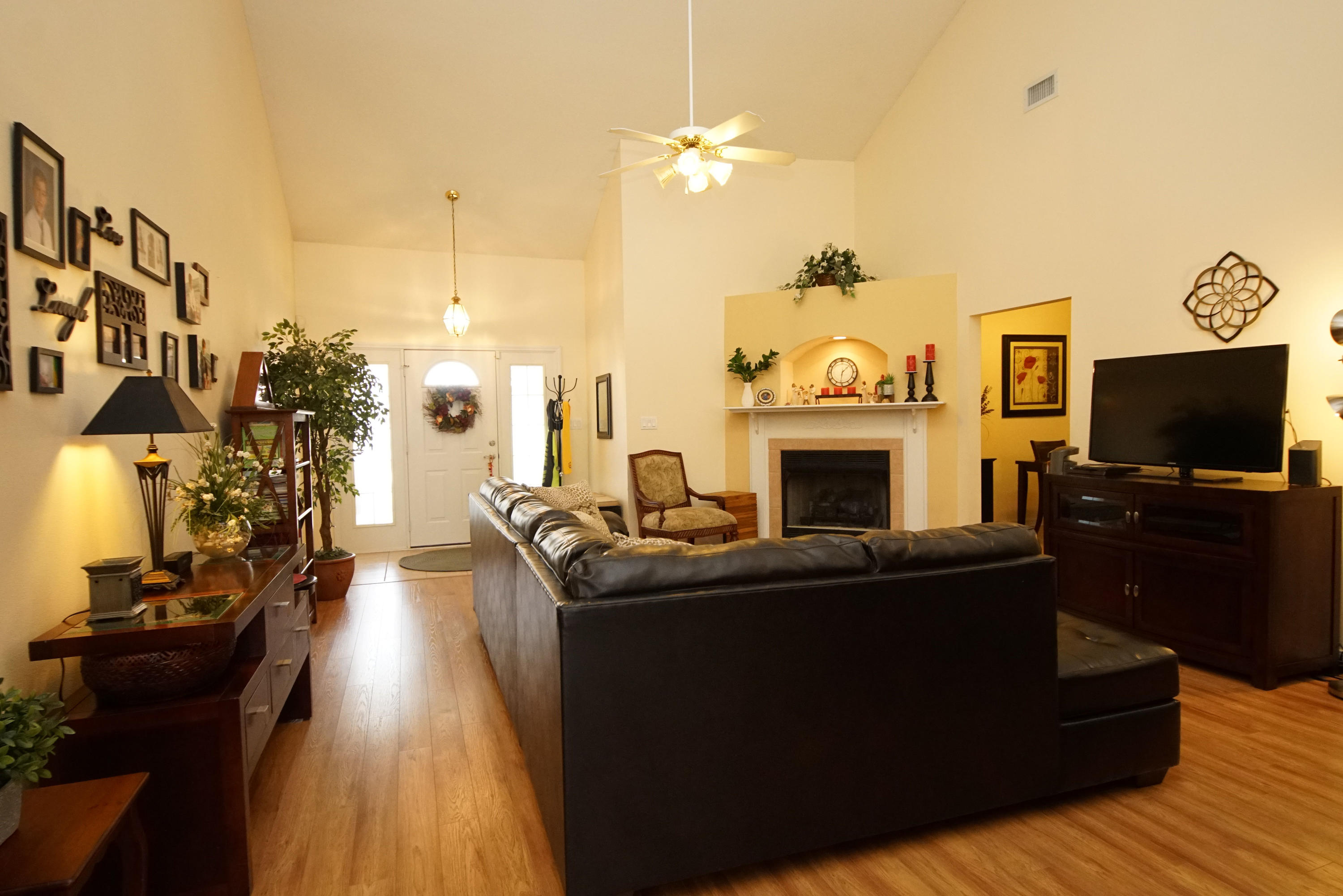 1956 Woodcrest Ridge Fort Walton Beach, FL 32547 - Photo 4 of 23 a living room with fireplace furniture and a flat screen tv