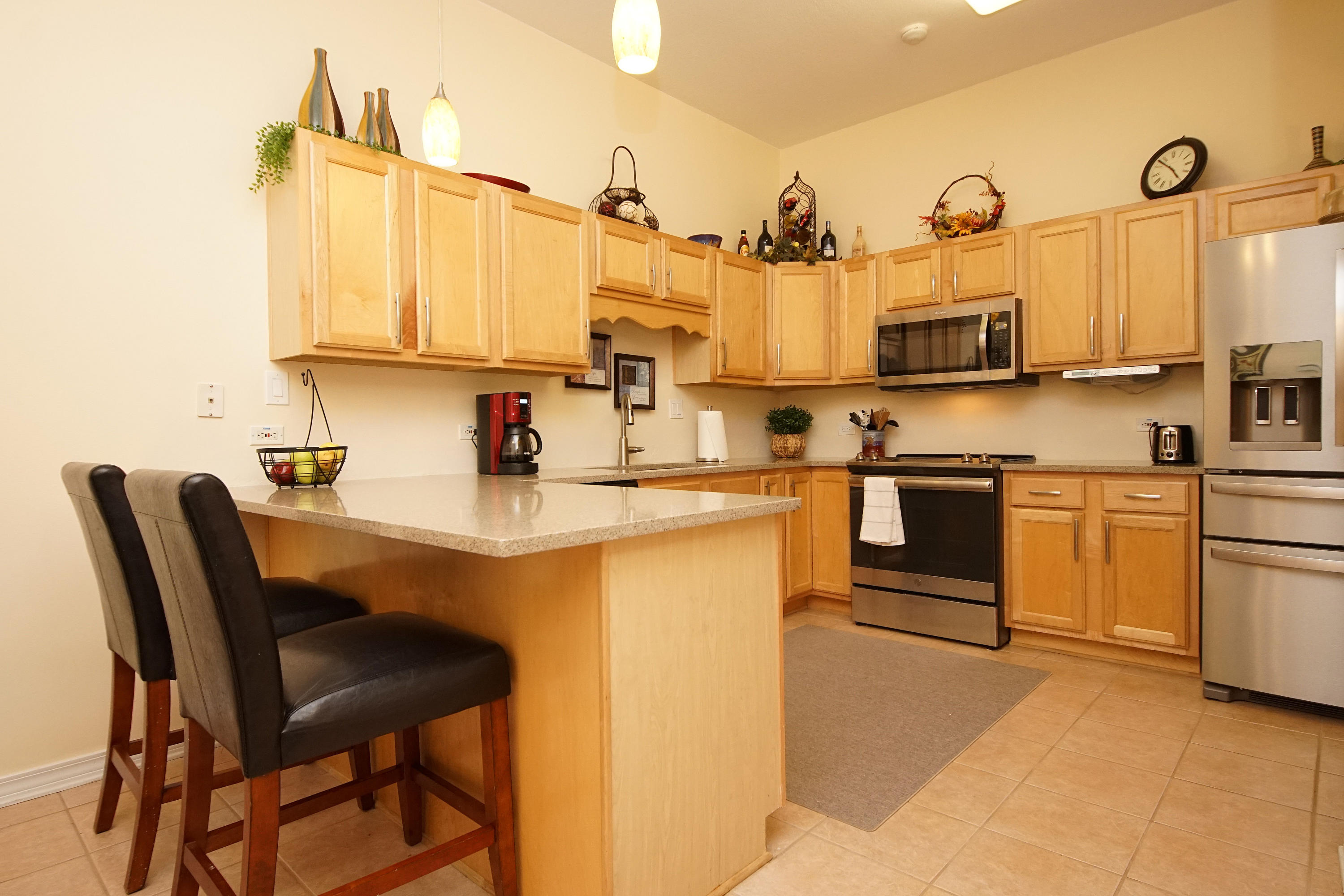 1956 Woodcrest Ridge Fort Walton Beach, FL 32547 - Photo 6 of 23 a kitchen with cabinets and chairs