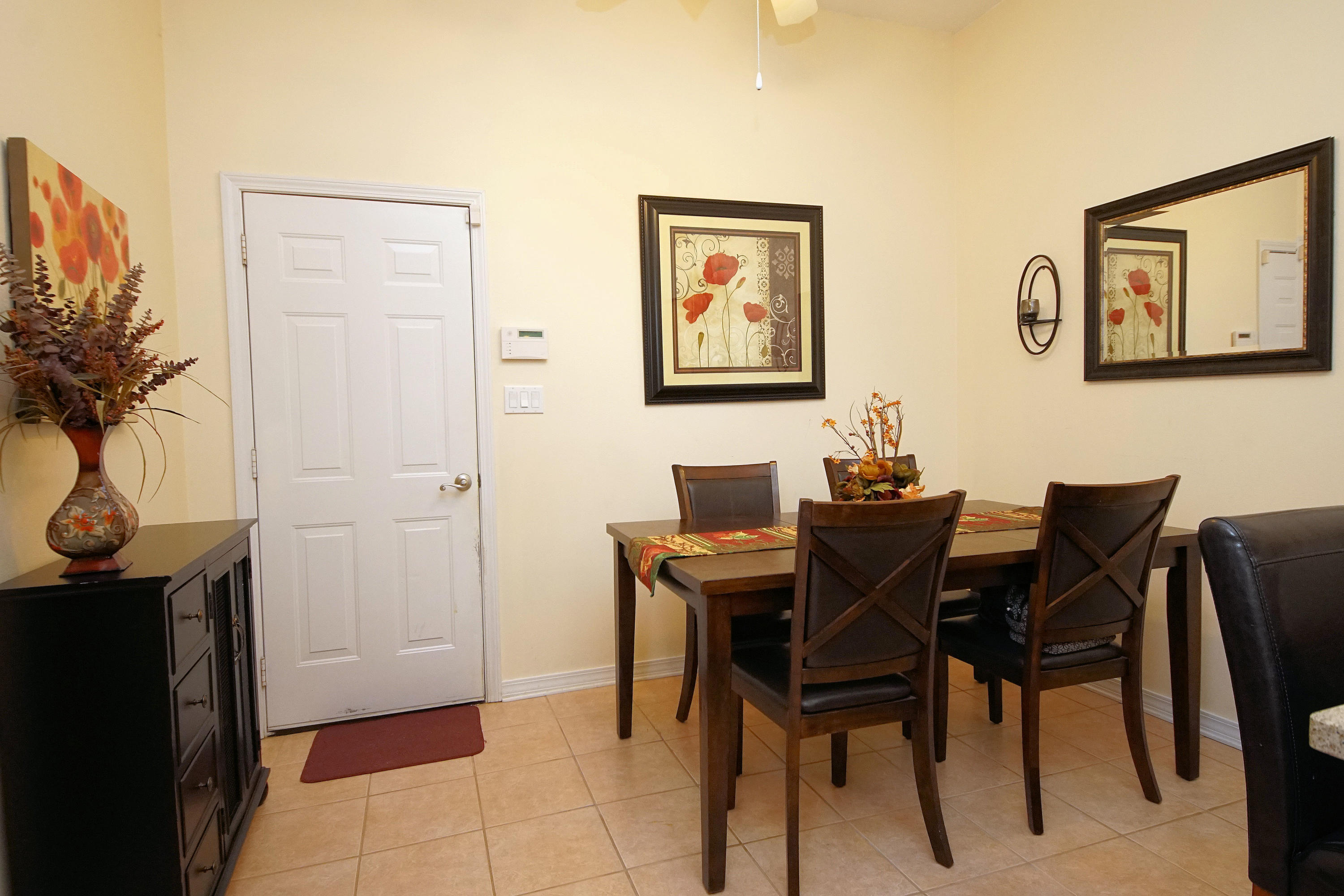 1956 Woodcrest Ridge Fort Walton Beach, FL 32547 - Photo 9 of 23 a view of a dining room with furniture and a potted plant