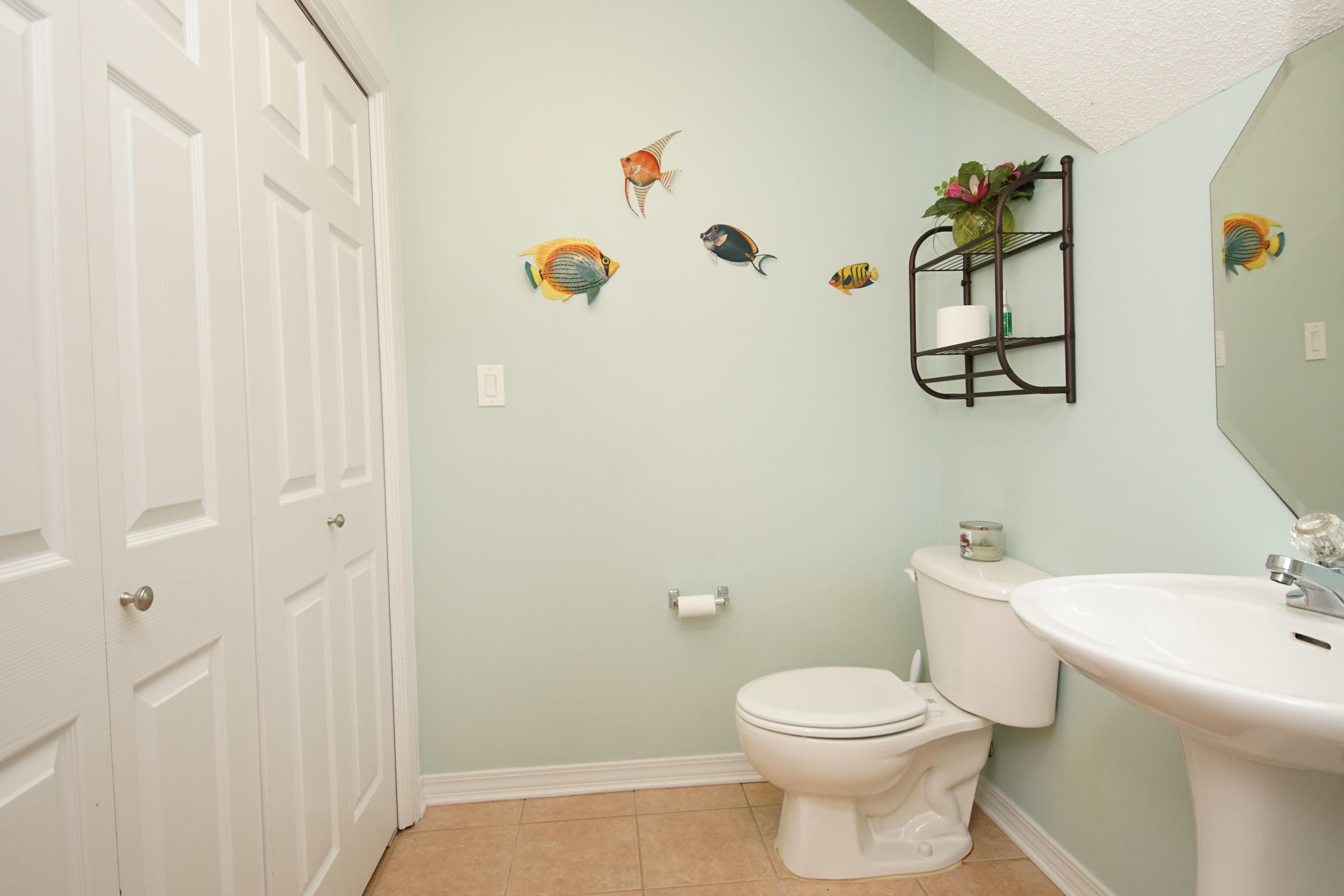 1956 Woodcrest Ridge Fort Walton Beach, FL 32547 - Photo 10 of 23 a bathroom with a toilet and a sink