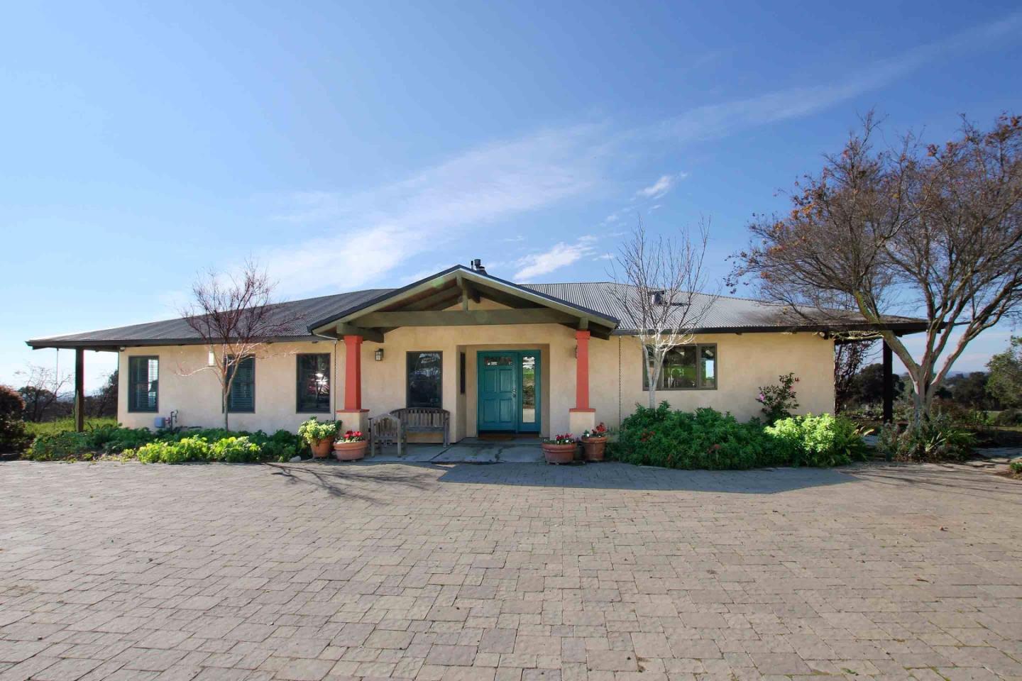 266 Webb Road Watsonville, CA 95076 - Photo 1 of 40 a front view of a house with a yard and garage