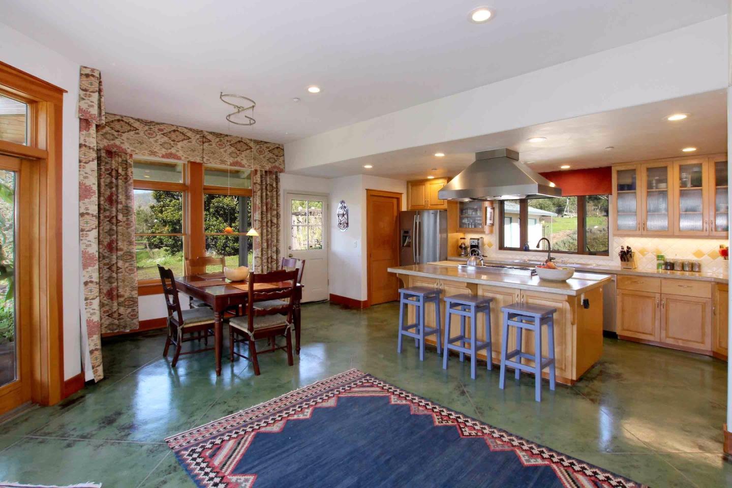 266 Webb Road Watsonville, CA 95076 - Photo 11 of 40 a living room with lots of furniture a dining table and a large window