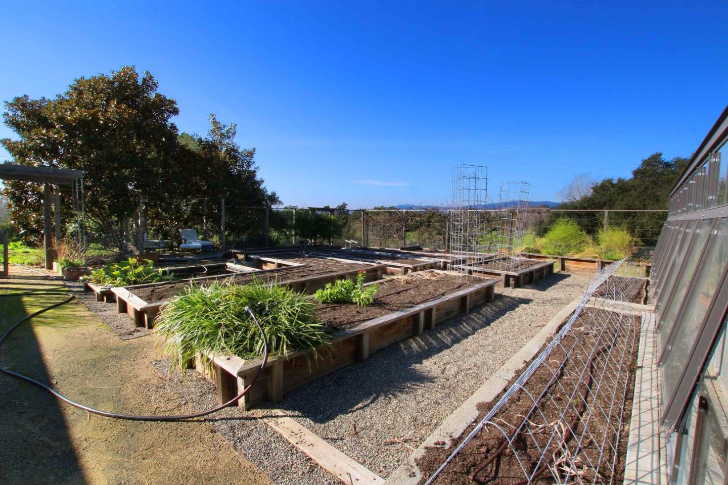 266 Webb Road Watsonville, CA 95076 - Photo 27 of 40 a view of a swimming pool with a patio and couches chairs