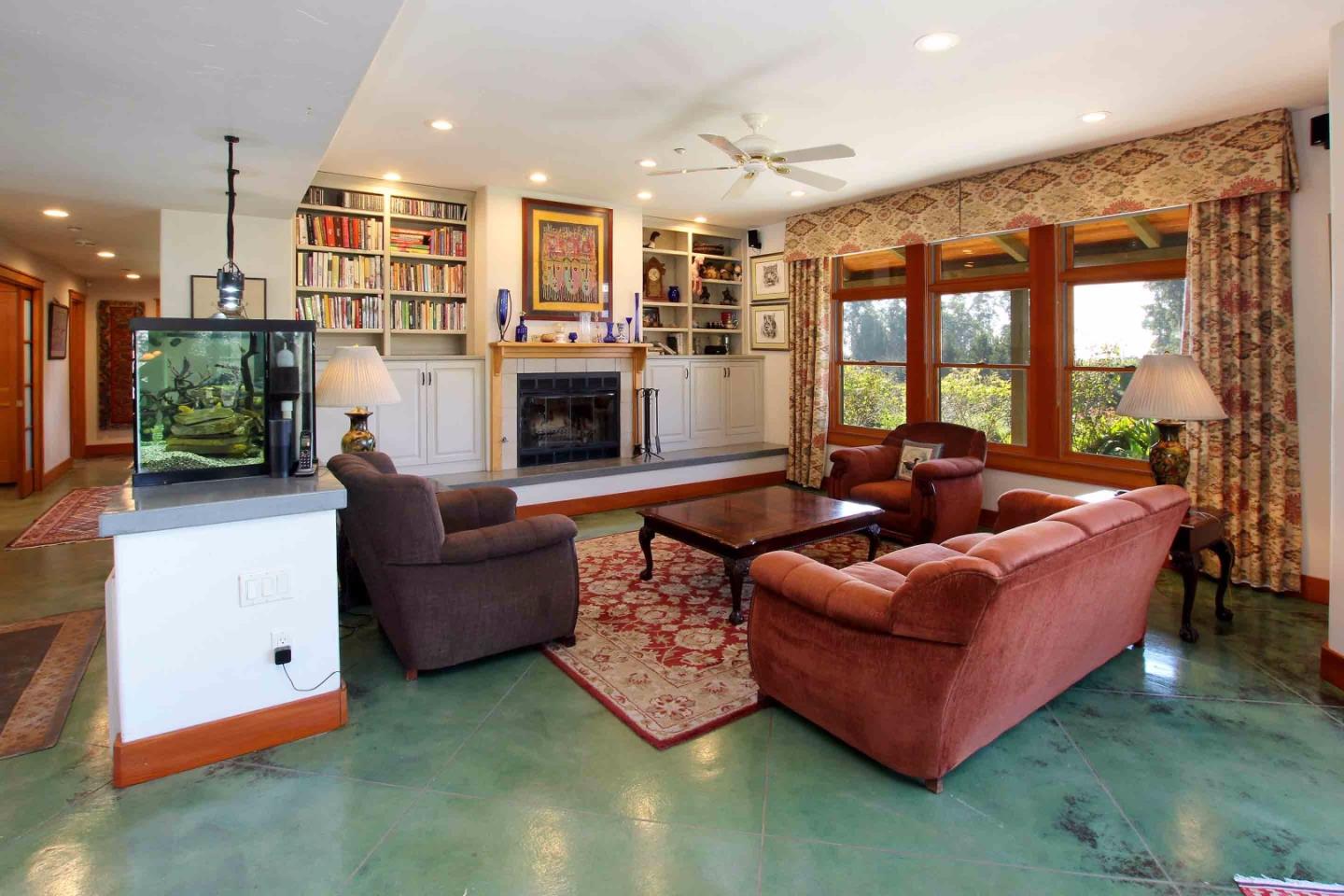 266 Webb Road Watsonville, CA 95076 - Photo 4 of 40 a living room with furniture kitchen view and a large window