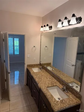 a kitchen with stainless steel appliances granite countertop wooden cabinets a oven a sink and a counter