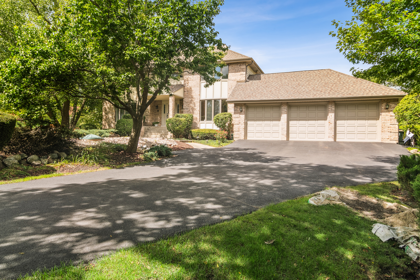 2223 Shetland Road Inverness, IL 60010 - Photo 1 of 40 a front view of a house with a yard and garage
