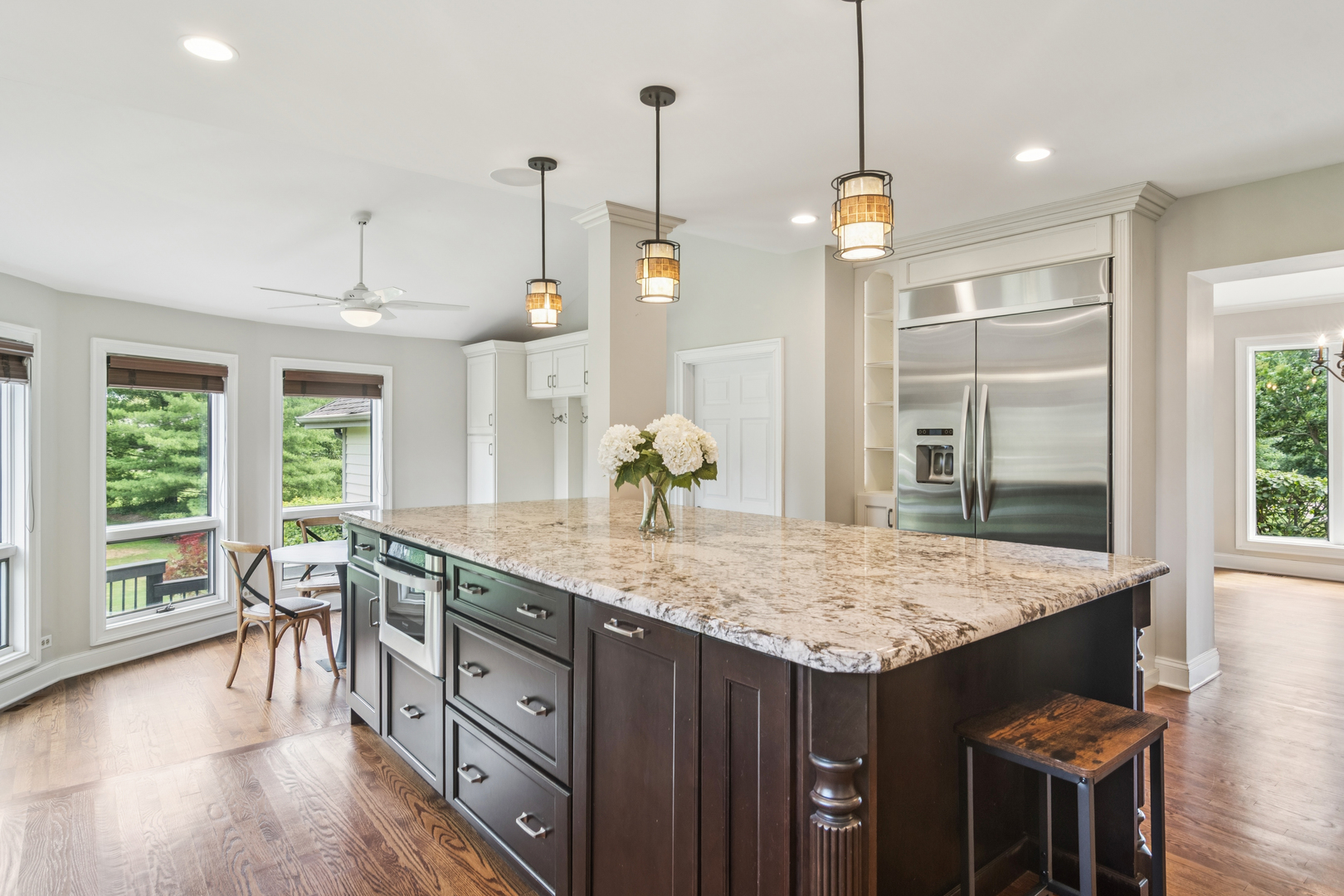 2223 Shetland Road Inverness, IL 60010 - Photo 6 of 40 a kitchen with center island table and chairs