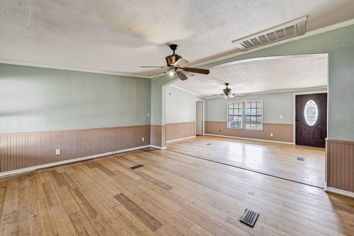 858 Big Hawg Road Trinity, TX 75862 - Photo 11 of 45 a view of an empty room with a window and wooden floor