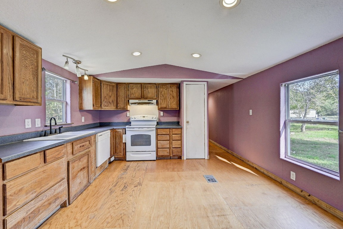 858 Big Hawg Road Trinity, TX 75862 - Photo 29 of 45 a kitchen with stainless steel appliances a sink and cabinets