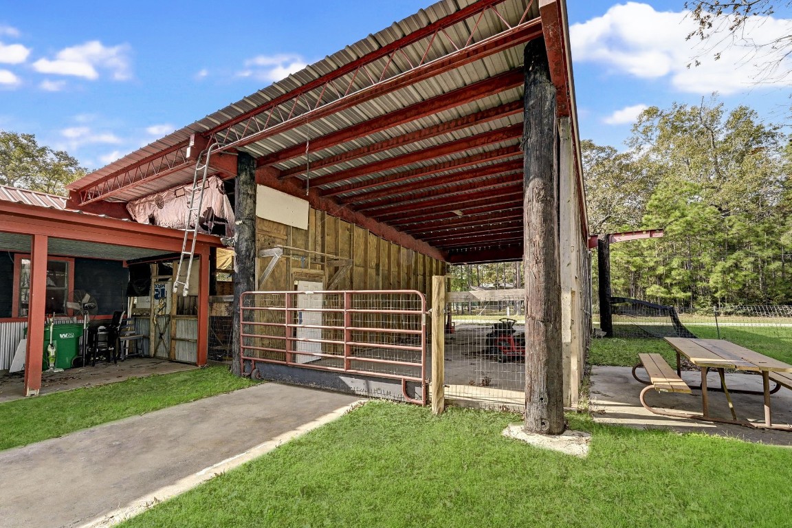858 Big Hawg Road Trinity, TX 75862 - Photo 38 of 45 a view of a house with a backyard