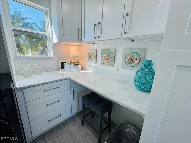 a room with cabinets and window