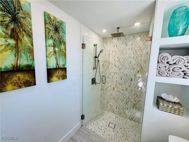 a bathroom with a shower and a sink