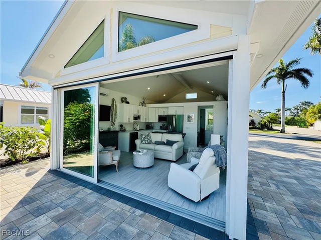 a view of a patio with couches and potted plants