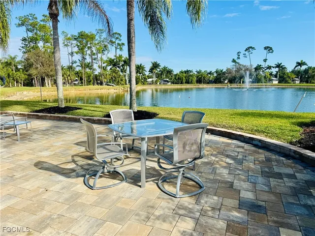 a view of a swimming pool and lounge chairs
