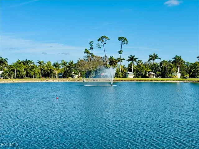 a view of outdoor space with deck and lake view