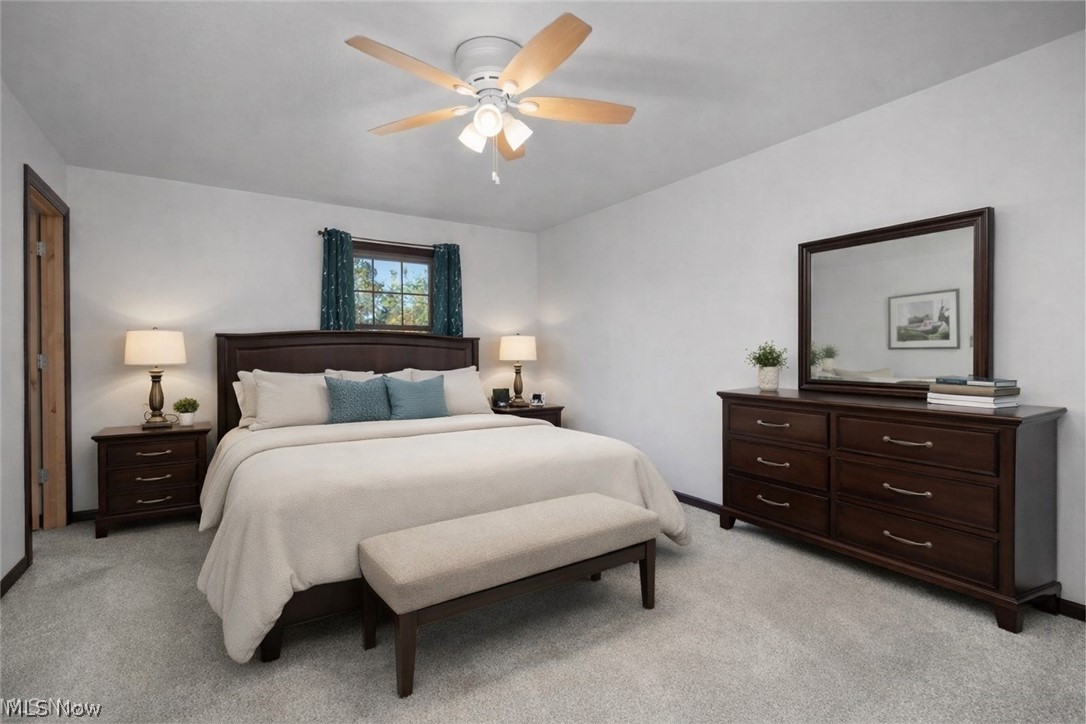 6760 Mason Road Berlin Heights, OH 44814 - Photo 15 of 49 Bedroom featuring light carpet and a ceiling fan