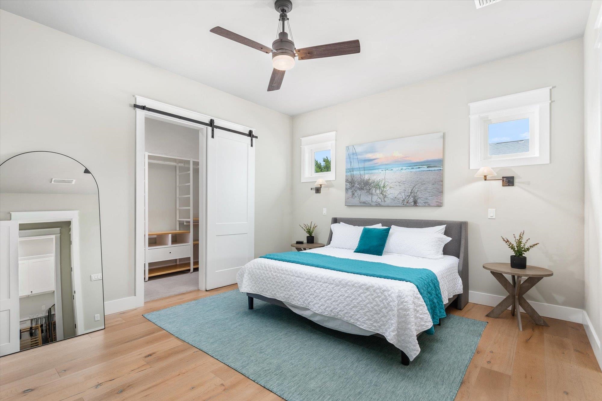 80 Ferrol Road St. Augustine, FL 32084 - Photo 19 of 61 a bedroom with a bed wooden floor and a table