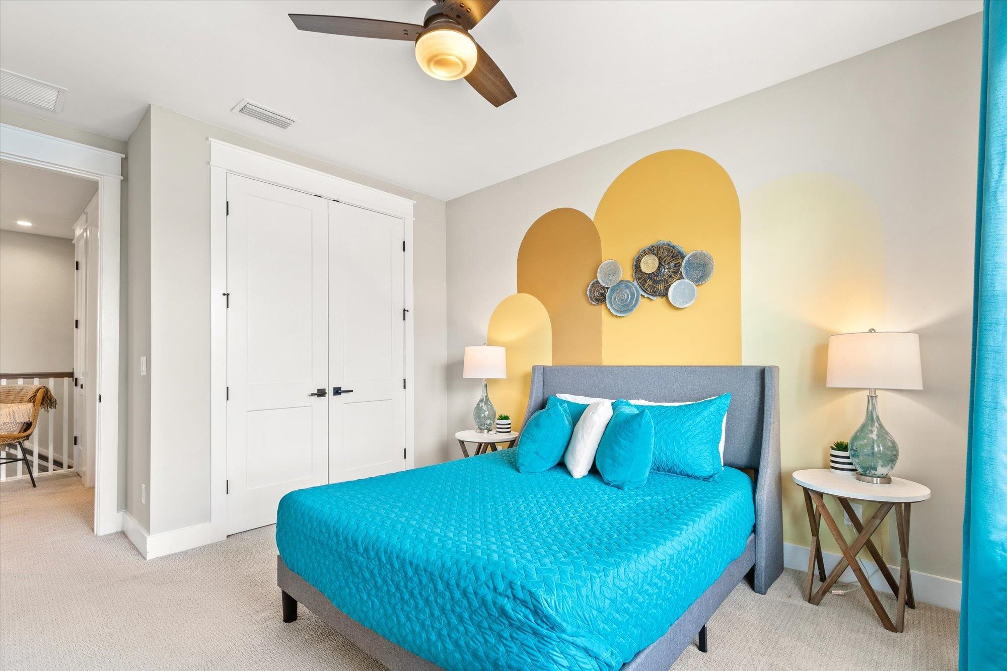 80 Ferrol Road St. Augustine, FL 32084 - Photo 31 of 61 a bedroom with a bed and a chandelier