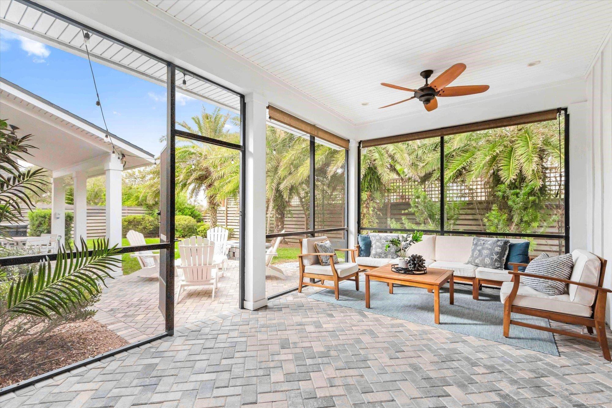 80 Ferrol Road St. Augustine, FL 32084 - Photo 36 of 61 a living room with a floor to ceiling window next to a yard