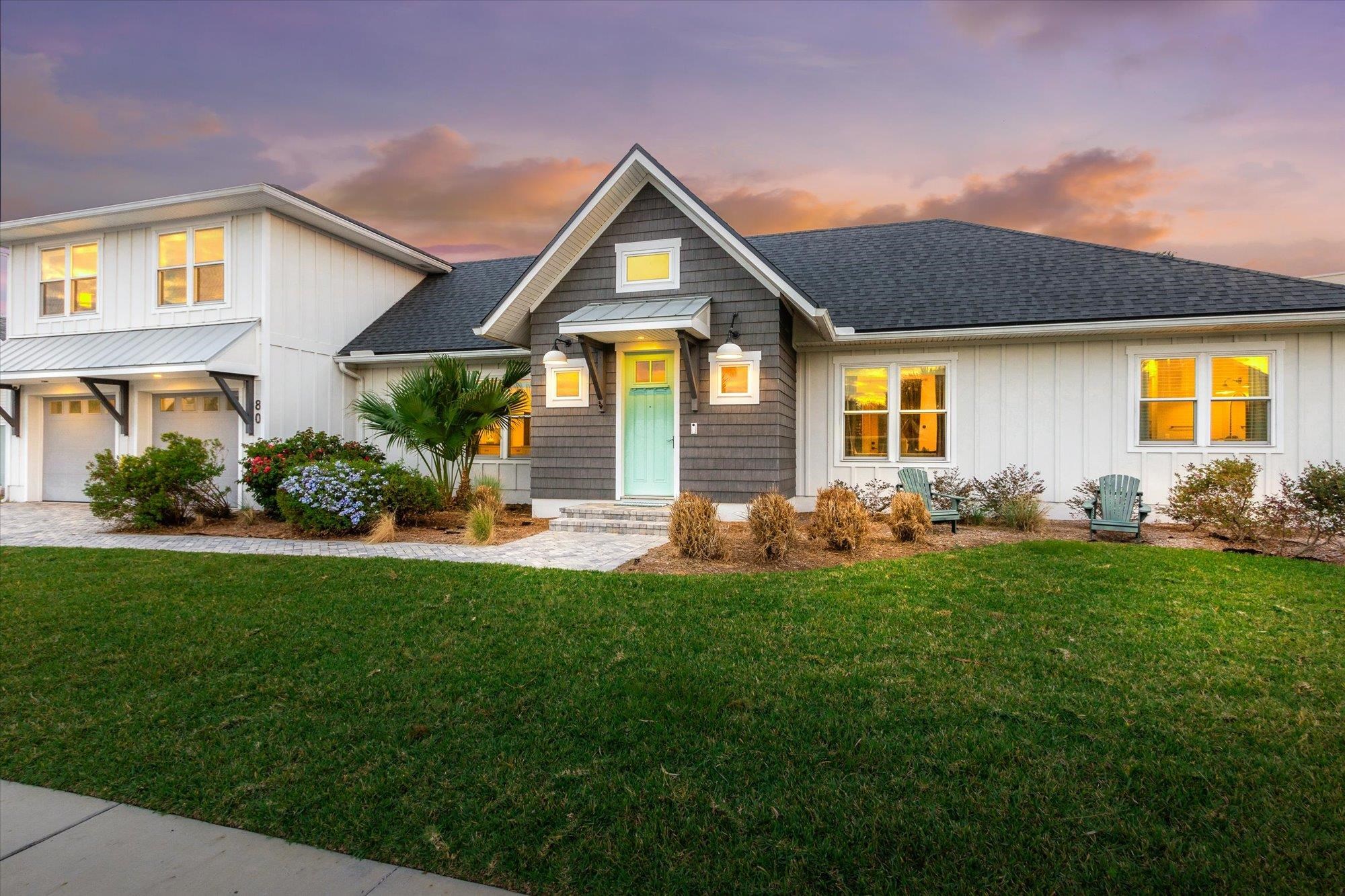 80 Ferrol Road St. Augustine, FL 32084 - Photo 49 of 61 a front view of a house with a yard and trees