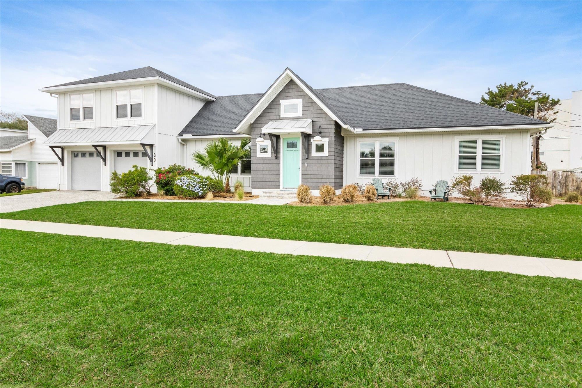 80 Ferrol Road St. Augustine, FL 32084 - Photo 50 of 61 a front view of a house with a yard and garage