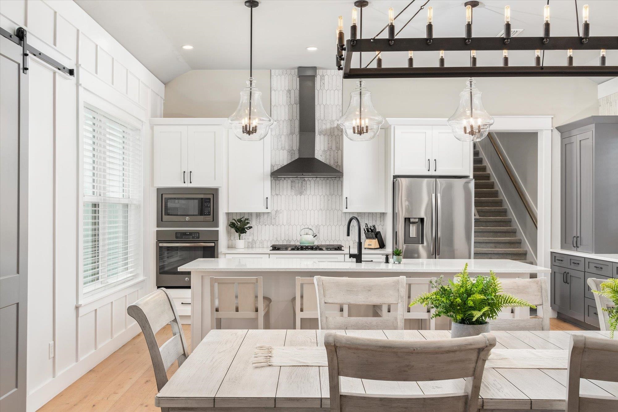 80 Ferrol Road St. Augustine, FL 32084 - Photo 7 of 61 a kitchen with a table chairs stove and kitchen view