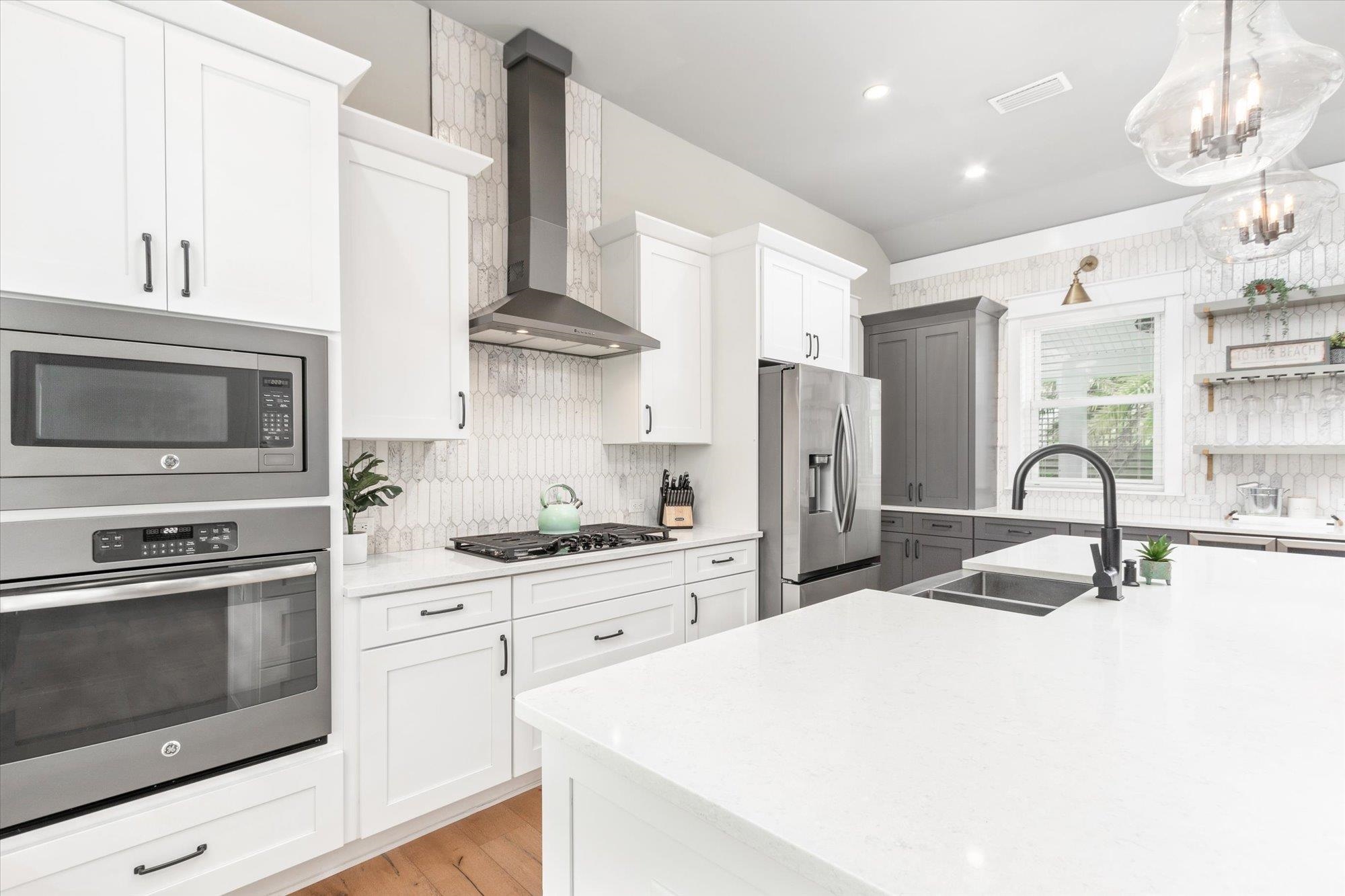 80 Ferrol Road St. Augustine, FL 32084 - Photo 9 of 61 a kitchen with stainless steel appliances kitchen island granite countertop a sink a stove and refrigerator