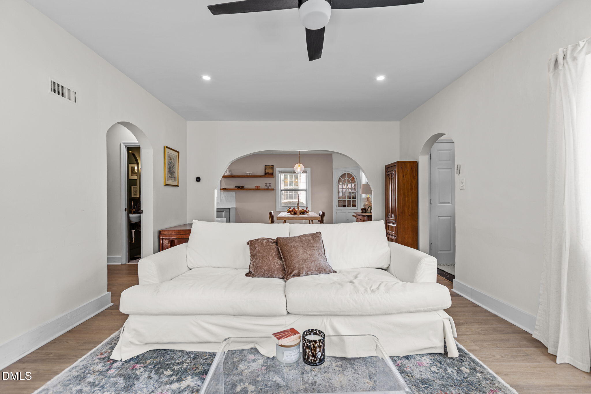 2707 North Roxboro Street Durham, NC 27704 - Photo 12 of 44 a living room with furniture and a wooden floor