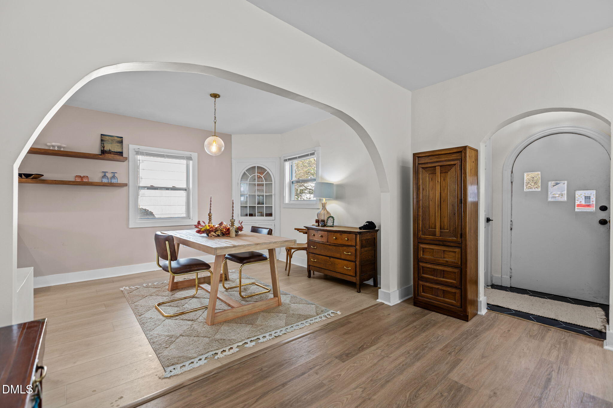2707 North Roxboro Street Durham, NC 27704 - Photo 16 of 44 a living room with furniture a table and wooden floor