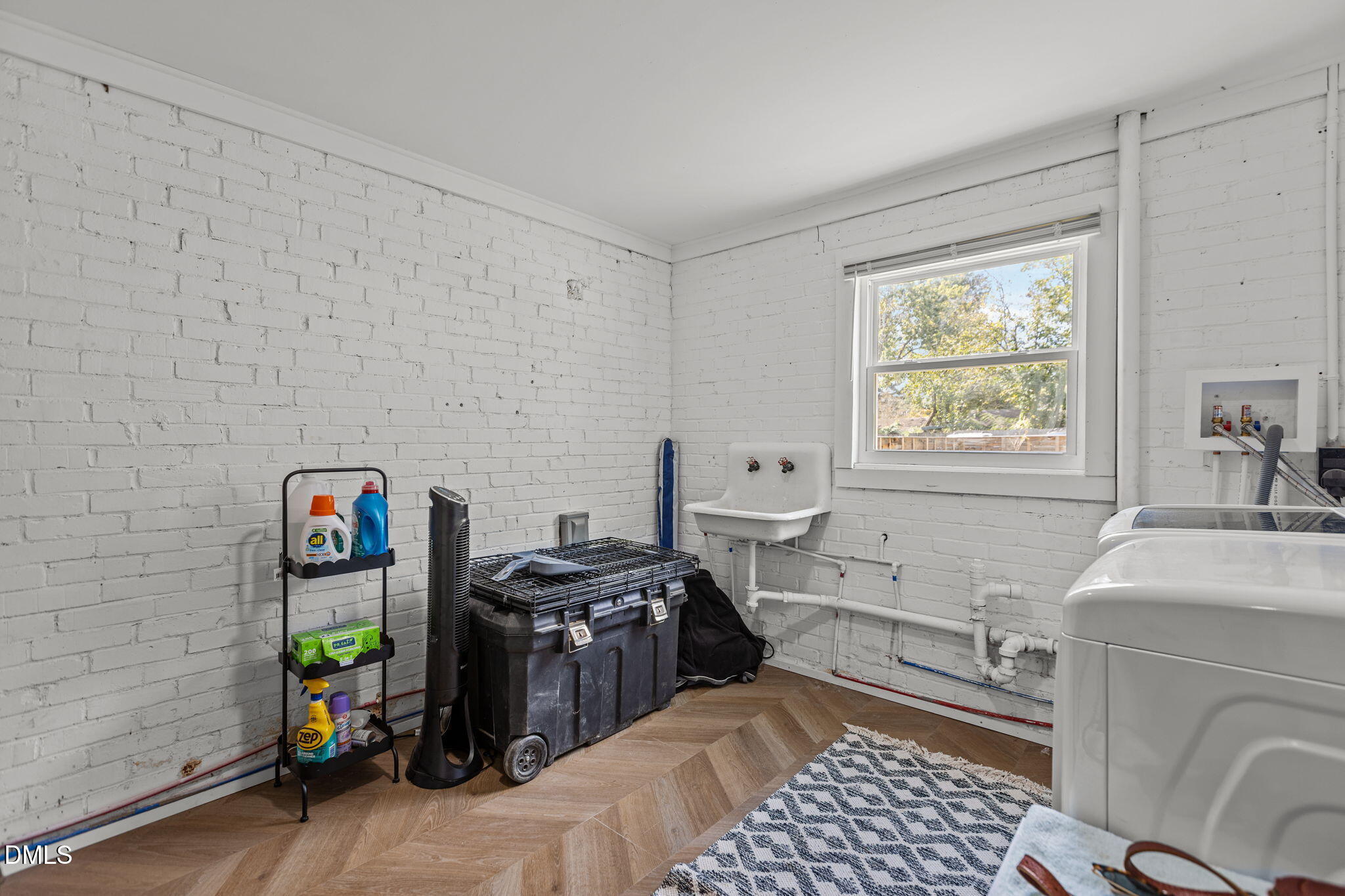 2707 North Roxboro Street Durham, NC 27704 - Photo 29 of 44 a view of a storage & utility room with a window