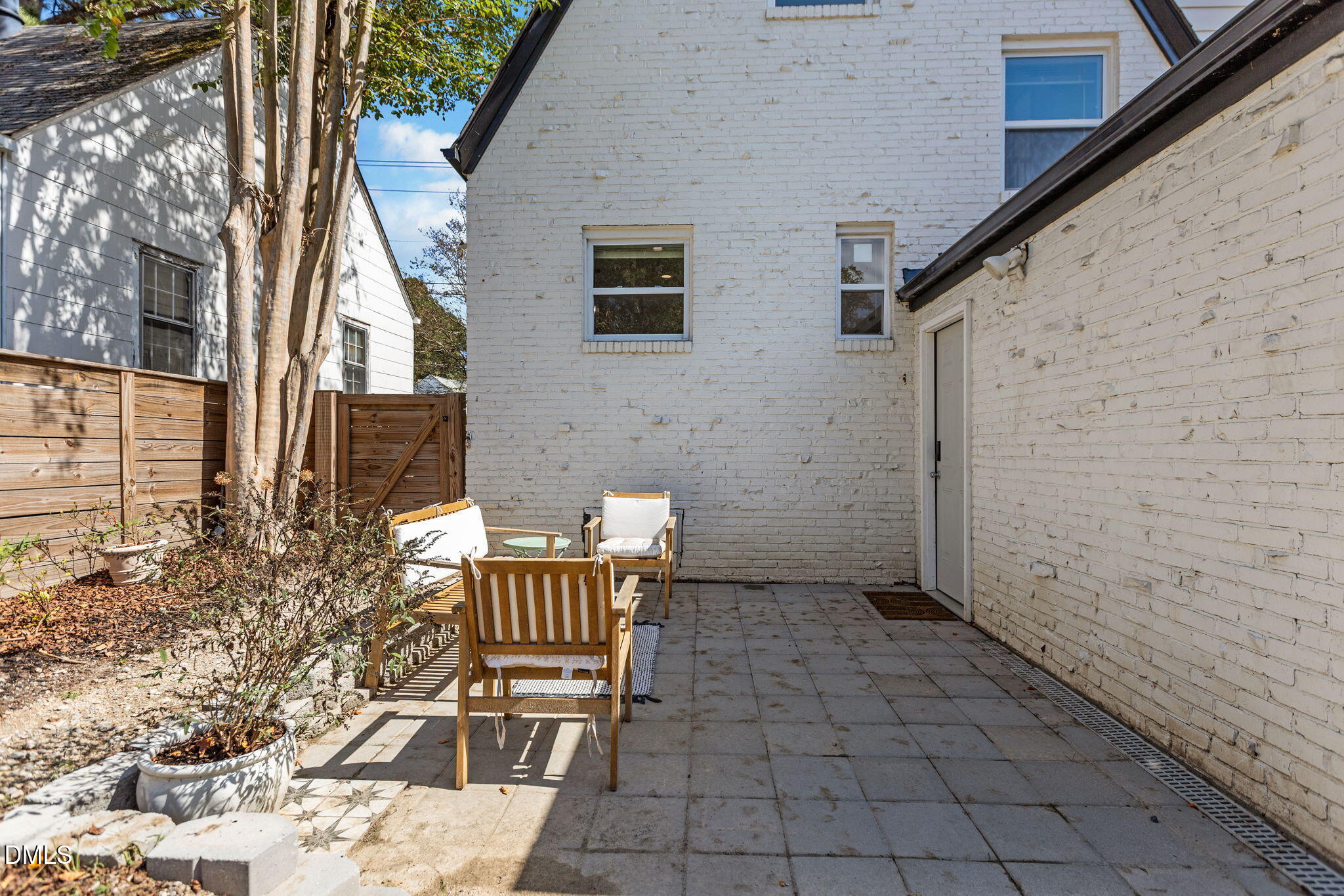 2707 North Roxboro Street Durham, NC 27704 - Photo 30 of 44 a view of a patio with table and chairs and potted plants