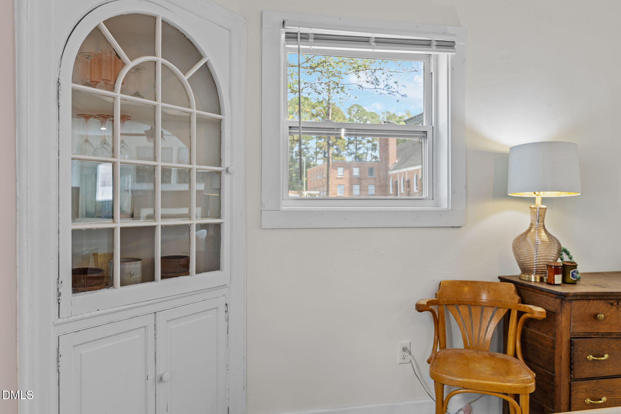 2707 North Roxboro Street Durham, NC 27704 - Photo 3 of 44 a room that has a chair and a window in it