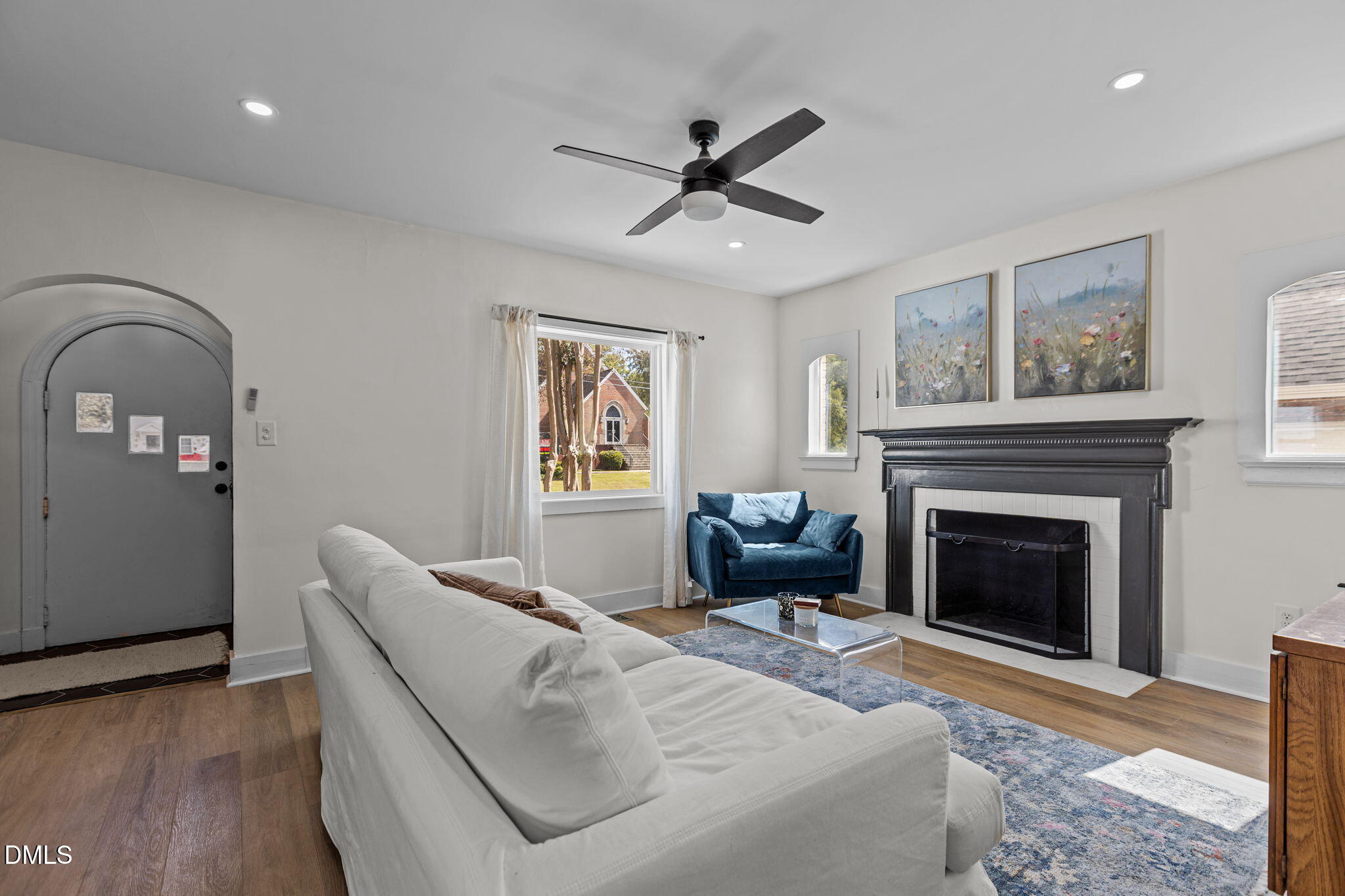 2707 North Roxboro Street Durham, NC 27704 - Photo 4 of 44 a living room with furniture and a fireplace