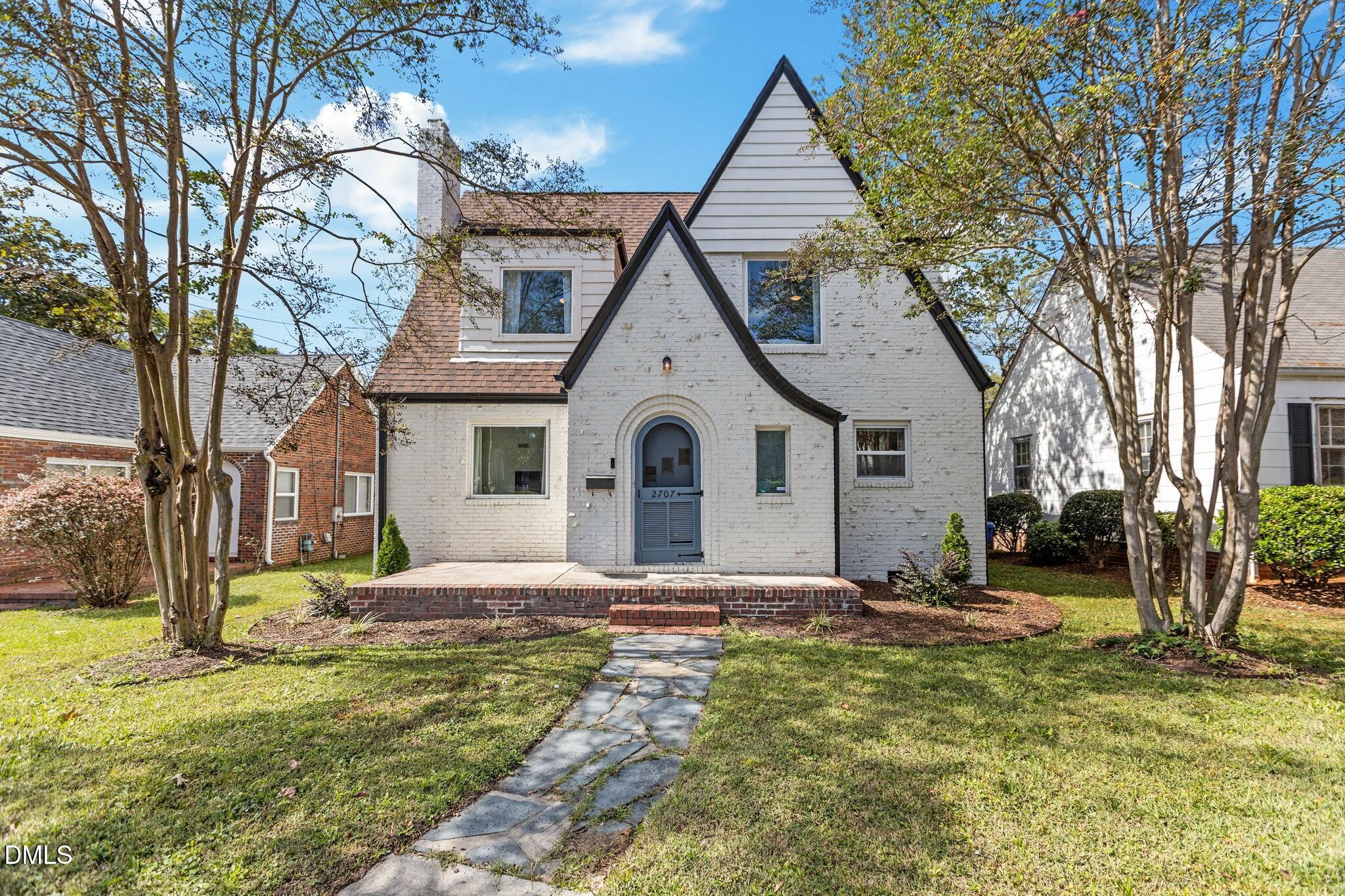 2707 North Roxboro Street Durham, NC 27704 - Photo 8 of 44 a view of a house with a yard