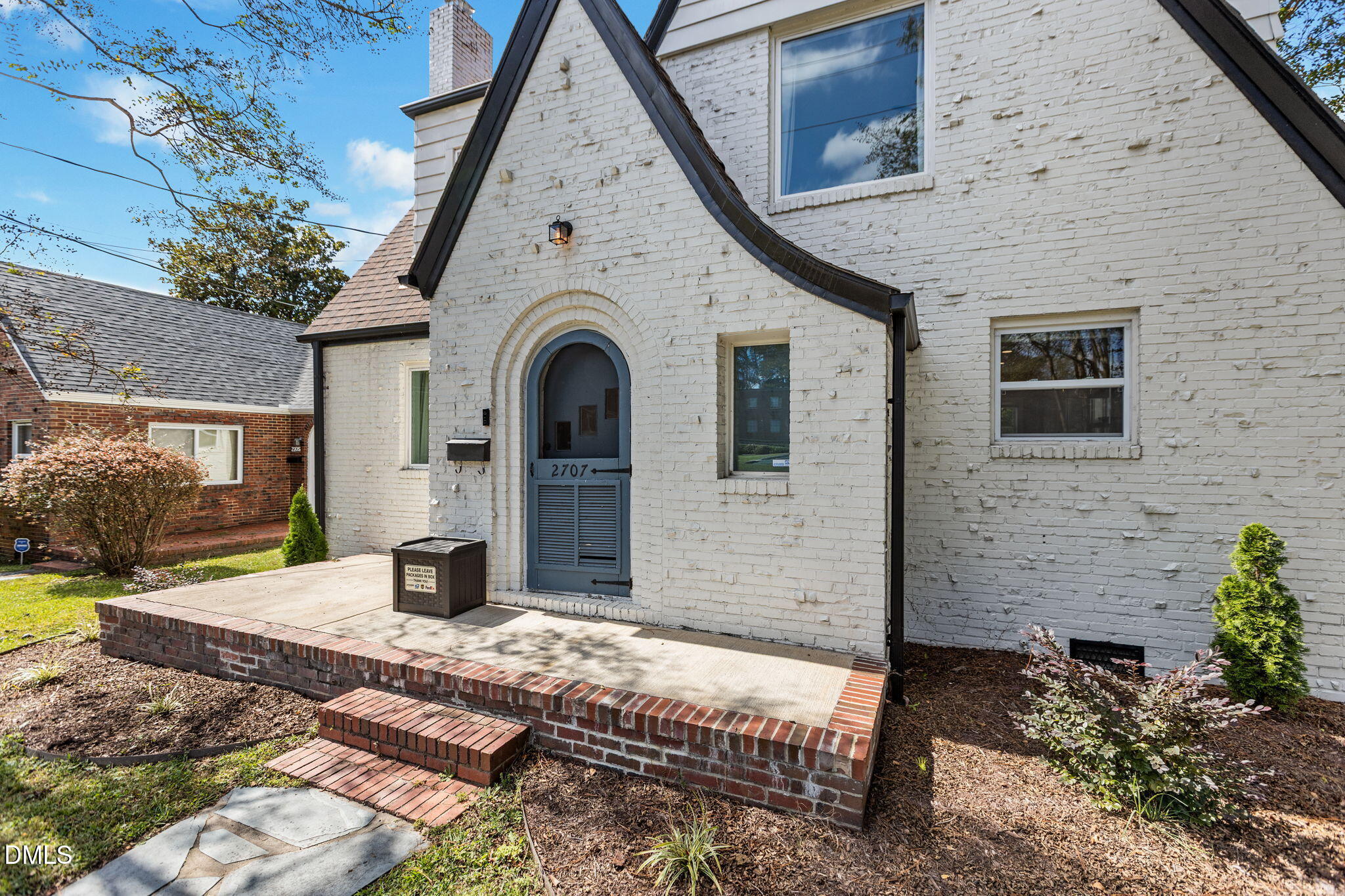 2707 North Roxboro Street Durham, NC 27704 - Photo 9 of 44 a front view of a house with garden