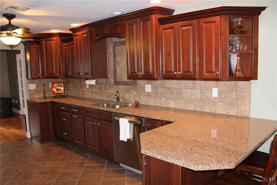 6435 Jacksonville Road Bath, PA 18014 - Photo 4 of 24 GOURMET KITCHEN WITH GRANITE COUNTERS AND TILE BAC