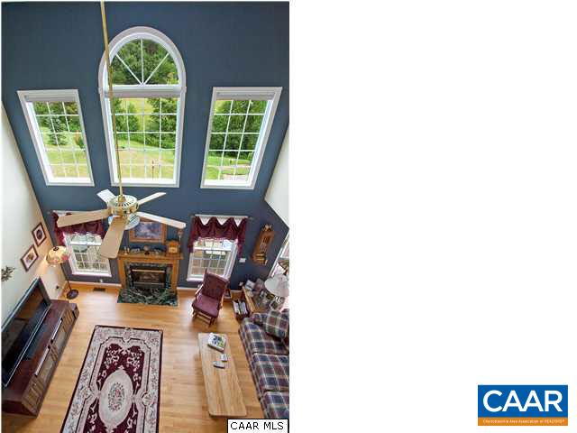 9075 Critzer Shop Road Afton, VA 22920 - Photo 11 of 32 a living room with furniture and a fireplace