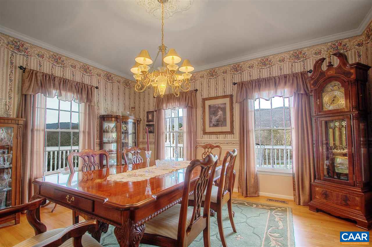 9075 Critzer Shop Road Afton, VA 22920 - Photo 15 of 32 a view of a dining room with furniture wooden floor and chandelier