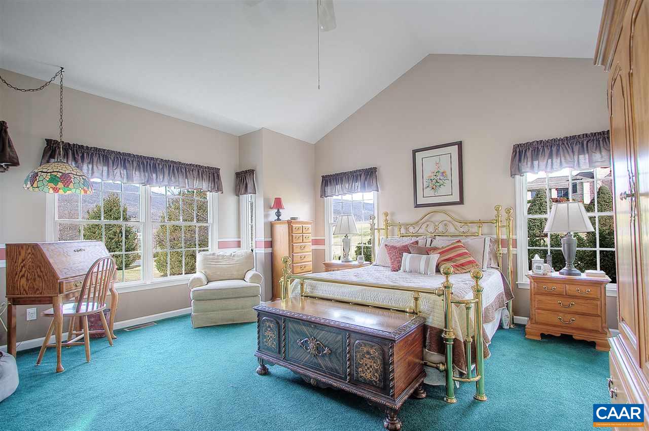 9075 Critzer Shop Road Afton, VA 22920 - Photo 16 of 32 a bedroom with a bed and a couch