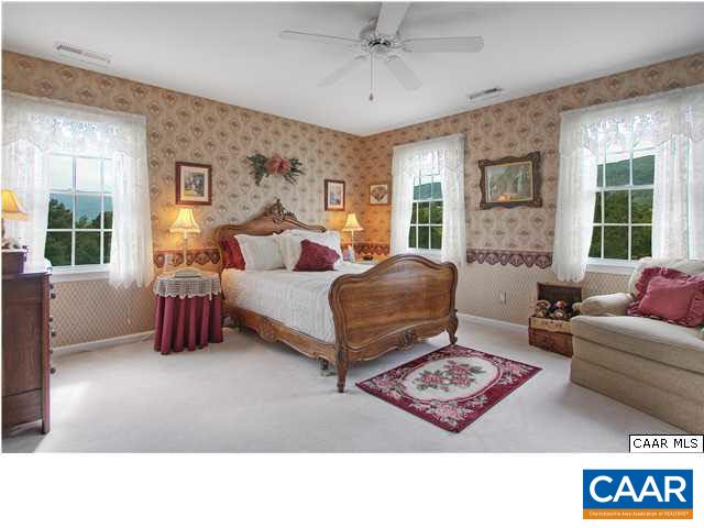 9075 Critzer Shop Road Afton, VA 22920 - Photo 21 of 32 a living room with furniture gym equipment and a large window