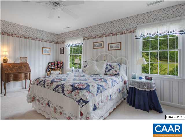 9075 Critzer Shop Road Afton, VA 22920 - Photo 22 of 32 a bed room with a bed window and couch