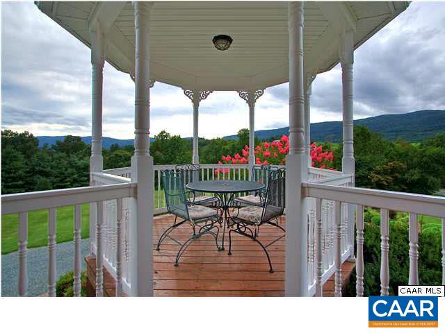9075 Critzer Shop Road Afton, VA 22920 - Photo 5 of 32 a view of a chairs and table in the balcony