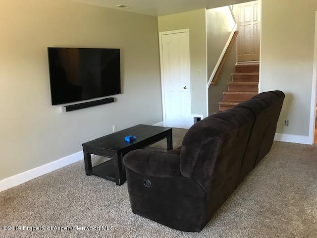 520 Elm Court Rifle, CO 81650 - Photo 18 of 37 a living room with furniture and a flat screen tv