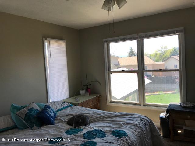 520 Elm Court Rifle, CO 81650 - Photo 26 of 37 a bedroom with a bed and a window