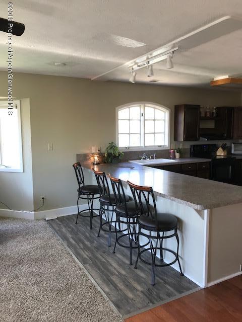 520 Elm Court Rifle, CO 81650 - Photo 27 of 37 a view of a dining room with furniture and window