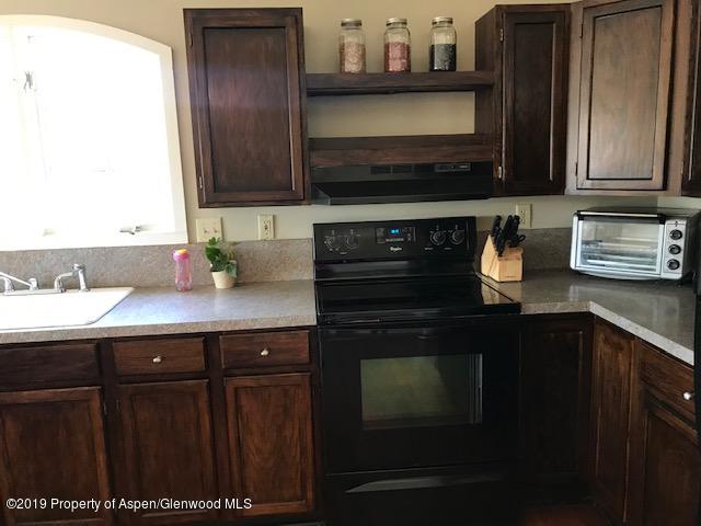 520 Elm Court Rifle, CO 81650 - Photo 29 of 37 a kitchen with a sink and cabinets