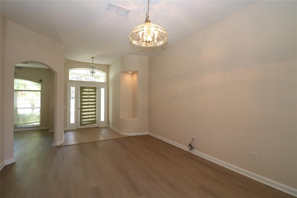 605 Cheviot Court Apopka, FL 32712 - Photo 11 of 32 wooden floor in an empty room with a window