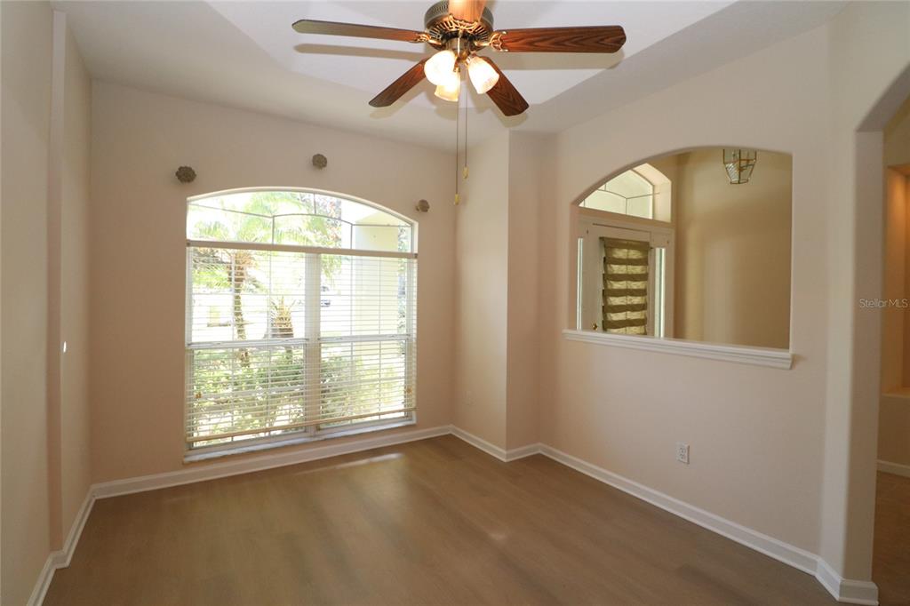 605 Cheviot Court Apopka, FL 32712 - Photo 13 of 32 an empty room with a window and a chandelier